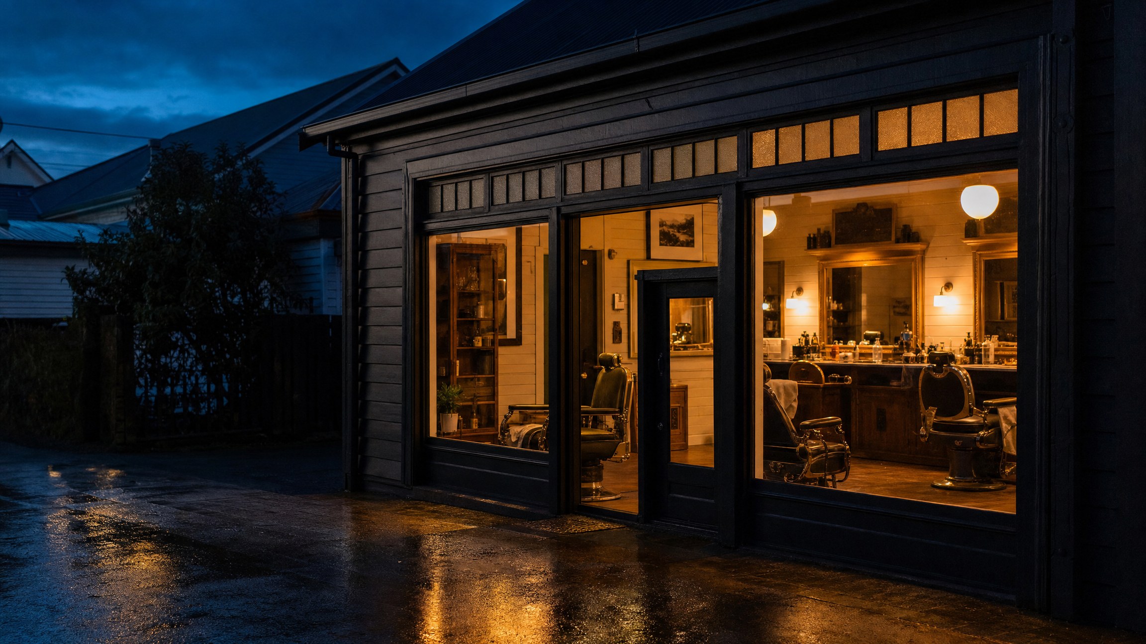 The Halloran Barbers shopfront at dusk